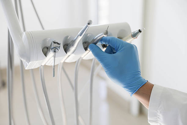 Professional Tooth Extraction technician working in Fairview Shores, FL